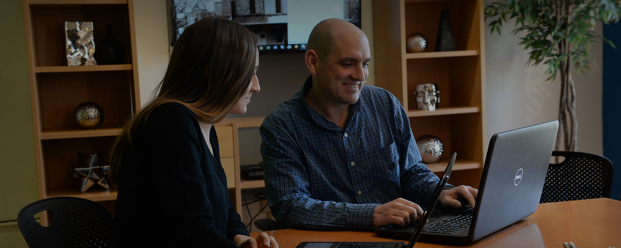 digital marketing team developing a strategy with office dog