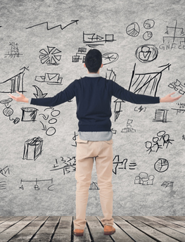 Man standing in front of idea board with arms out