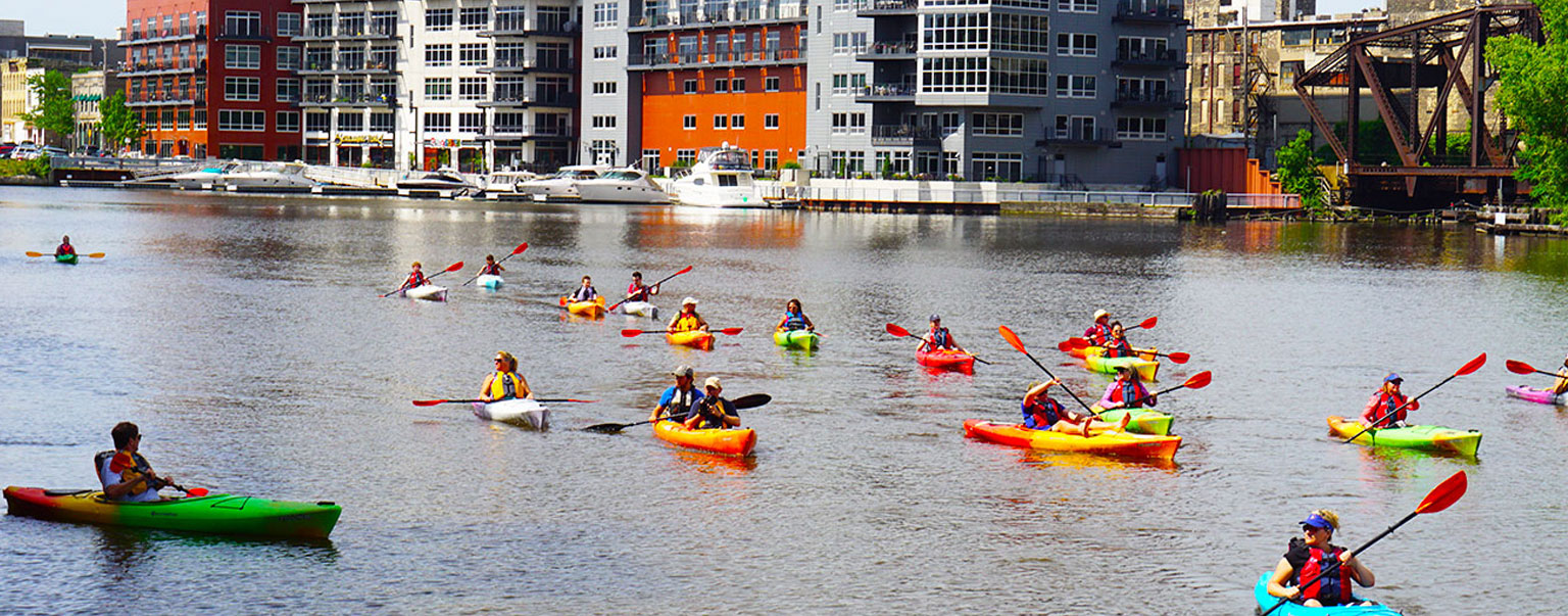 People kayaking on the Milwaukee River People kayaking on the Milwaukee River