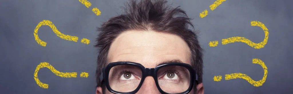 man with glasses questions above head