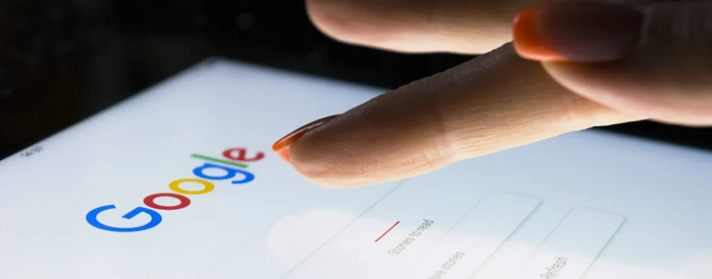 woman's fingers touching screen