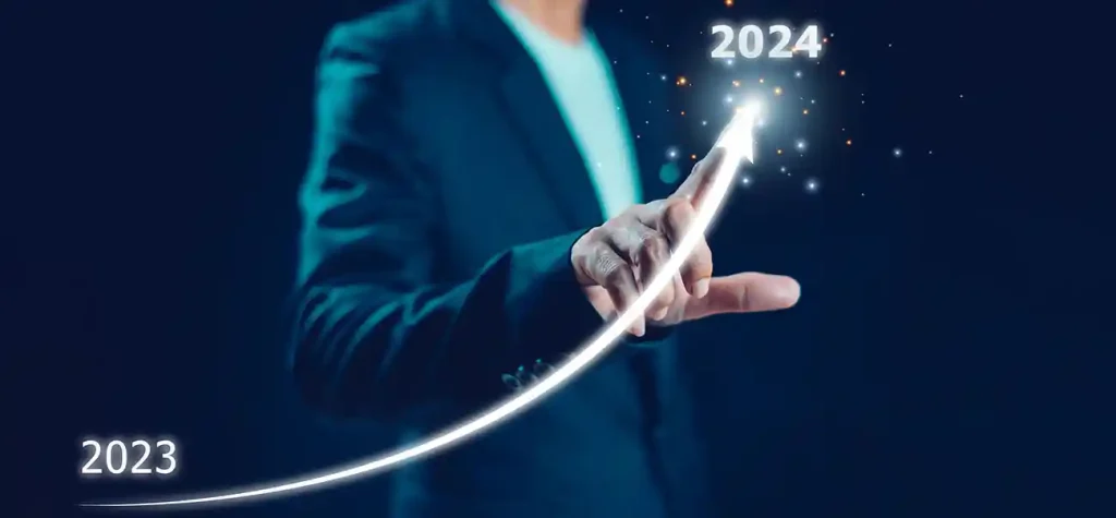 mans finger pointing to arrow with 2023 to 2024