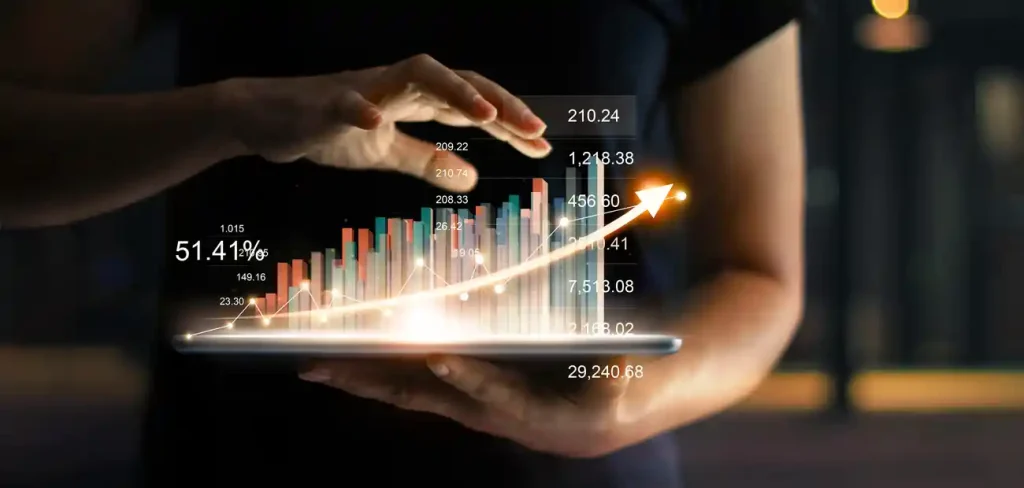 hands holding tablet with stats coming out of it