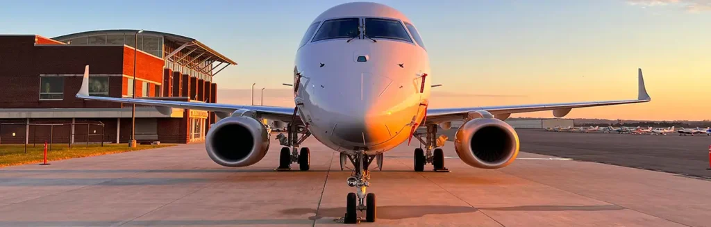 Airplane on the tarmac at Manassas Regional Airport at sunset