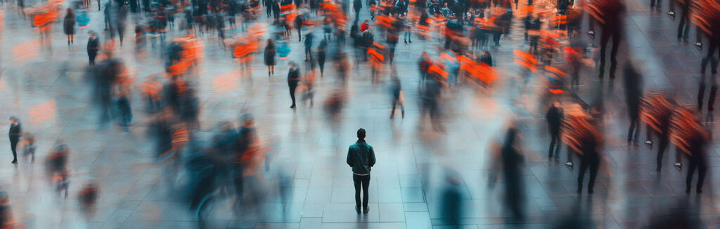 Blurred crowd moving around a single focused individual representing clarity in AI-driven B2B marketing
