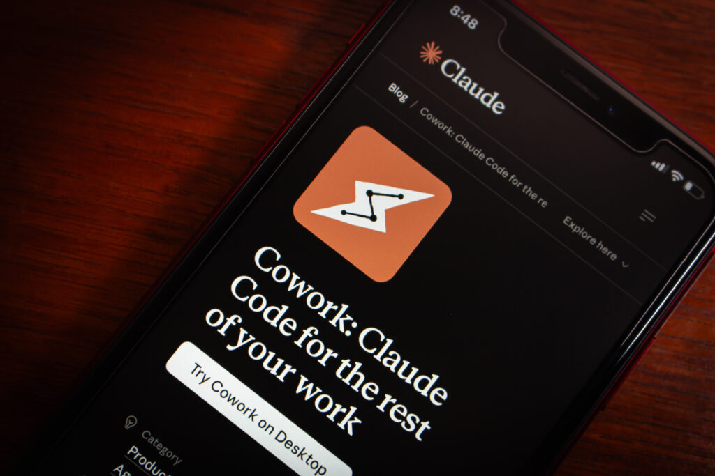 Claude Cowork and Claude Code displayed on a mobile device screen highlighting Anthropic’s new AI coworker and coding tools